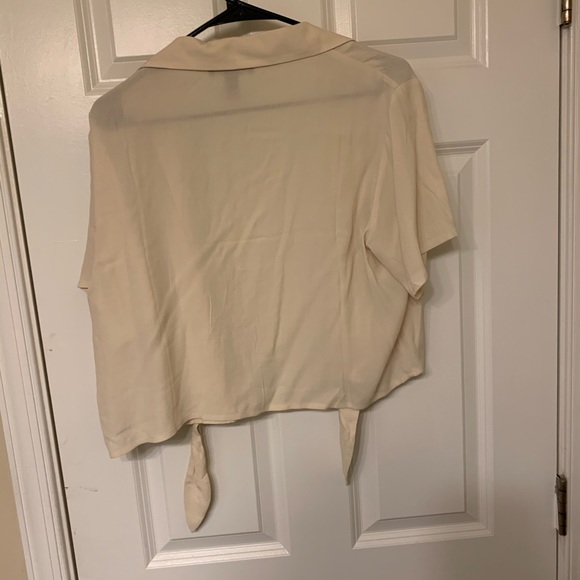 A beige, lightweight crop tie with tie front. - Picture 2 of 2